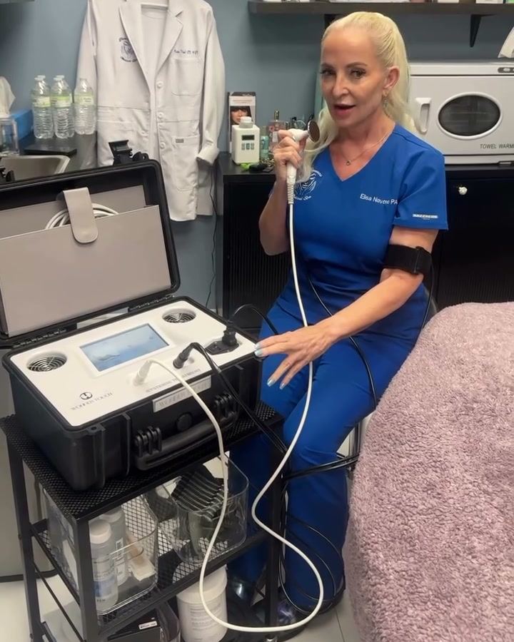Elisa Navone, PA-C, with the Wonder Touch device at Pure Elements Medical Spa